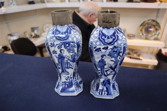 A pair of Chinese blue and white canted rectangular baluster vases, Kangxi period, H.26.7cm, one neck with section lacking obscured by